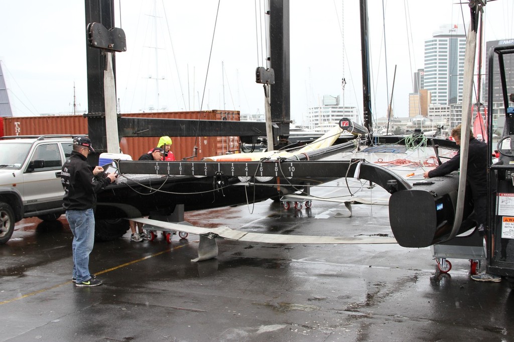 Emirates Team NZ’s first  SL-33 sits in the travelift slings at the team’s base in the Viaduct harbour © Richard Gladwell www.photosport.co.nz